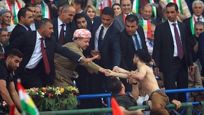 Iraqi Kurdish President Masoud Barzani shakes hands while attending a rally to show their support for the upcoming September 25th independence referendum in Duhuk, Iraq September 16, 2017. REUTERS/Ari Jalal