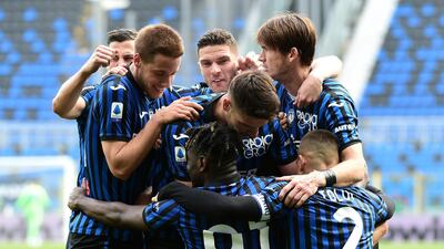 Ruslan Malinovskyi celebrates with his Atalanta teammates after scoring the winner. Getty