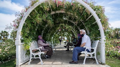 Elderly people sit on benches in the Maltepe Orhangazi city park in Istanbul, Turkey. EPA