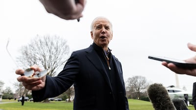 US President Joe Biden speaks to members of the media before boarding Marine One in Washington, on December 23. Bloomberg