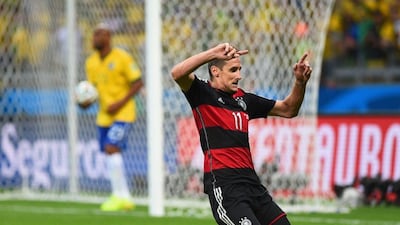 Germany's Miroslav Klose celebrates scoring his team's second goal in their 7-1 win over Brazil on Tuesday at the 2014 World Cup semi-finals in Belo Horizonte, Brazil. Laurence Griffiths / Getty Images