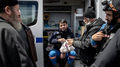A man collects food being distributed by medics in Nabatieh, southern Lebanon. Getty Images