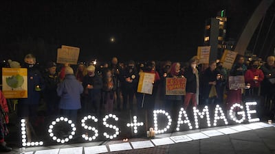 Activists outside the Cop26 venue in Glasgow on Wednesday night hold a vigil for people around the world experiencing the most severe climate effects. AFP