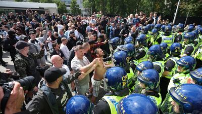 Protesters confront police officers in the English city of Manchester after demonstrations by members of far-right groups sprung up in the aftermath of a fatal stabbing attack in the town of Southport near Liverpool. EPA