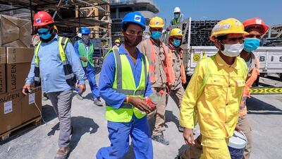 Construction workers take a break at the construction site in Al Raha Gardens. Victor Besa / The National