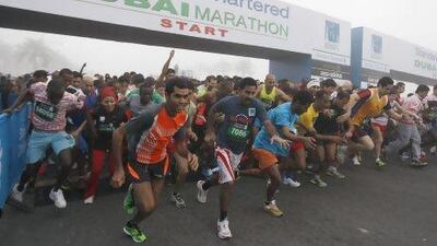 Athletes get off and running in the Standard Chartered Dubai Marathon yesterday.