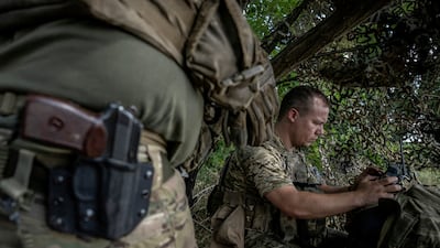 A Ukrainian serviceman operates a drone. Reuters