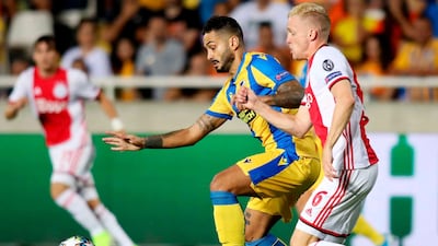 Ajax midfielder Donny van de Beek tracks APOEL's Savvas Gentsoglou. AFP