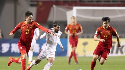 Youssef Kalfa of Syria, Yu Hai and Hao Junmin of China in action. Stringer / Reuters