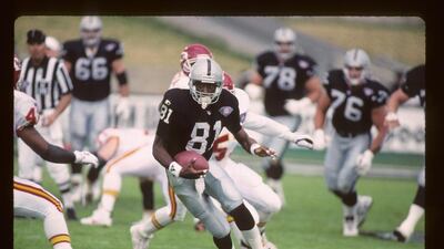 Los Angeles Raiders wide receiver Tim Brown (81) runs with a pass reception during a NFL football game against the Kansas City Chiefs, Sunday, December 24, 1994 in Los Angeles. The Chiefs won the game 19-9. (AP Photo/Paul Jasienski)