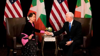 US Vice President Mike Pence, right, shakes hands with Myanmar State Counsellor Aung San Suu Kyi during a bilateral meeting on the sidelines of the 33rd Association of Southeast Asian Nations (ASEAN) summit in Singapore. AFP.