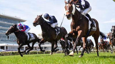 Jockey Jye McNeil, right, rides Twilight Payment to victory at the Melbourne Cup at Flemington Racecourse on Monday, November 3. Reuters