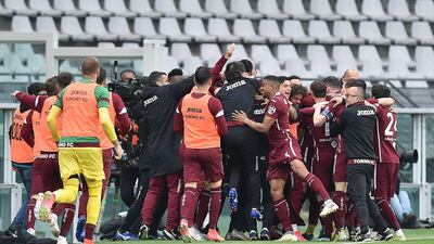 Torino players celebrate after making the score 2-1. EPA