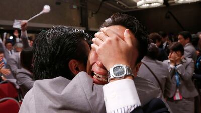Yuki Ota, the Japanese fencer, cries after the announcement. It is an emotional moment for the Japanese delegation whose campaign itself was highly charged, much like London 2012's was nine years earlier. Marcos Brindicci / Reuters