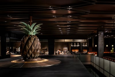 The restaurant’s centrepiece is an enormous ornamental pineapple that operates as a clock for staff and diners. Photo: Dinner by Heston Blumenthal