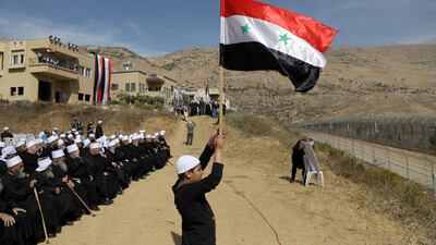 Druze people take part in a rally in Majdal Shams near the ceasefire line between Israel and Syria in the Israeli occupied Golan Heights, overlooking the other side of the border. Reuters