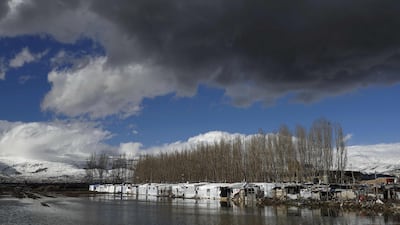 Rain water floods the grounds of an informal tent settlement housing Syrian refugees flooded by rain water in the area of Bar Elias, in the central Bekaa Valley. AFP