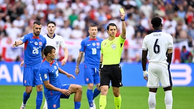 England's Marc Guehi is show a yellow card. AFP