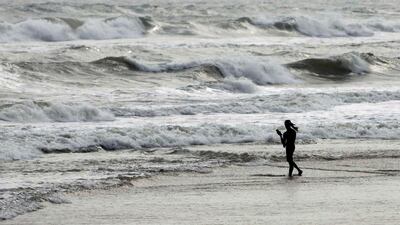 Fishermen, such as this one on the Bay of Bengal coast at Puri, Odisha state, and thousands of villagers have evacuated from coastal areas along India's eastern seaboard. Biswaranjan Rout / AP Photo