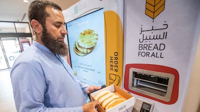 A vending machine at Aswaaq Al-Mizhar Community Centre bakes fresh bread. Ruel Pableo for The National