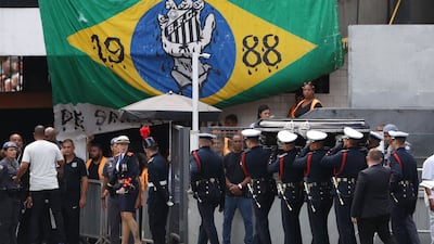 The casket of Pele is moved from Santos' Urbano Caldeira Stadium. Reuters