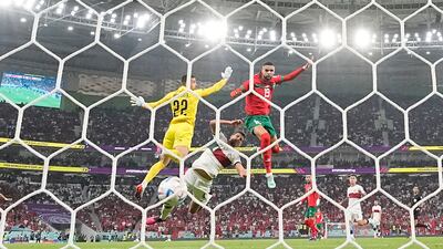 Morocco's Youssef En-Nesyri heads home in the first half. AP