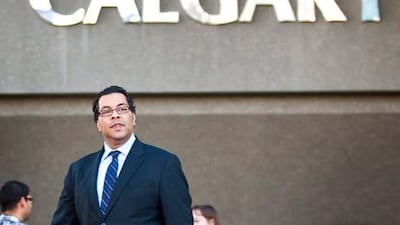 Naheed Nenshi walks outside Calgary city hall on Tuesday, one day after being elected to the mayoralty at age 38.