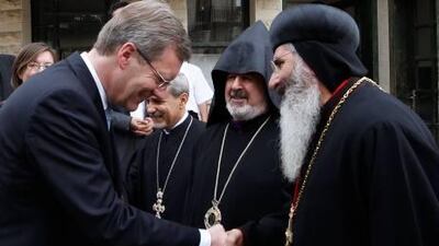 Germany's president Christian Wulff, left, is welcomed by Bishop Grigorios Melki Urek of Adiyaman in Tarsus, Turkey.