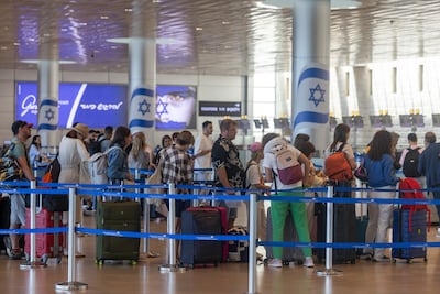 Passengers wait to check in at Ben Gurion International airport in Tel Aviv on Wednesday as flights resumed following a ceasefire with Iran. Bloomberg