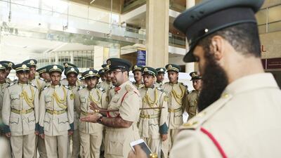 Brig Ghaith Al Suwaidi, Director of Dubai Police Academy, speaks to cadets after they cast their ballots on the last day of early voting at polling stations in Dubai on Wednesday. Sarah Dea / The National
