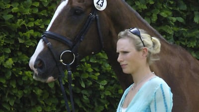 Zara Phillips, wearing a turquoise top and white trousers, leads her horse to a veterinary inspection before qualifying for competition at Bramham Park International Horse Trials on June 7, 2006 in Yorkshire. Andrew Stuart