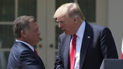 US president Donald Trump and Jordan's King Abdullah shake hands during a press conference in the rose garden of the White House on April 5, 2017. Susan Walsh / AP Photo