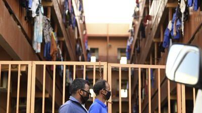 Foreign workers wearing protective masks amid the Covid-19 pandemic in Dubai. AFP
