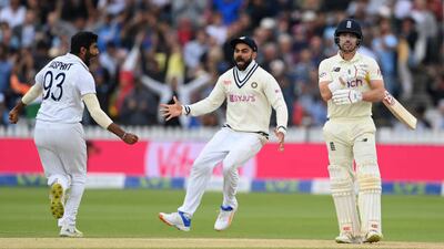 Jasprit Bumrah and Virat Kohli celebrate the wicket of Rory Burns of England during the 2021 Lord's Test. Getty