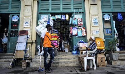 Mohammad Salim, 64, a Muslim from Karachi, Pakistan, sits outside his shop in downtown Maputo, Mozambique. March 21, 2019. Jack Moore / The National