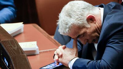 Outgoing Prime Minister Yair Lapid attends a special session of Israel's parliament, the Knesset, to swear in a new government. AFP