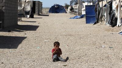 A displaced Iraqi child sits in a camp for internally displaced people near al-Khalidiyeh in Iraq's western Anbar province. While the election campaign is in full swing elsewhere in Iraq, the country's displaced camps barely register on the radars of those running for office, despite housing hundreds of thousands of people. Ahmad Al Rubaye / AFP