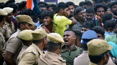 Indian police confront demonstrators protesting against a new national military recruitment policy, in the southern city of Chennai. EPA