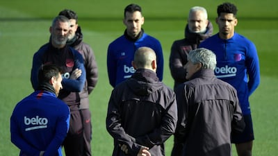 Barcelona manager Quique Setien talks to players during a training session at the Joan Gamper Sports City training ground. AFP