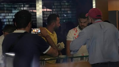 An armed woman and a dozen activists reportedly broke into a Beirut bank branch to retrieve more than $13,000 from what she said were her trapped savings. Lebanon's cash-strapped banks since 2019 have imposed strict limits on withdrawals of foreign currency, tying up the savings of millions. AP Photo