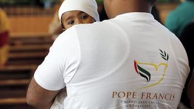 People attend the Pope Francis Papal mass live streaming at St Anthony of Padua Church in Ras Al Khaimah . Satish Kumar for the National