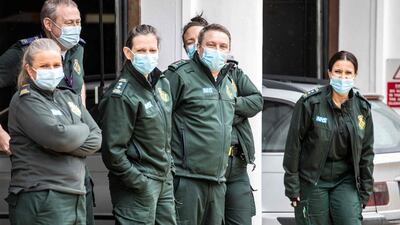 Paramedics await the arrival of Prince William and Catherine, Duchess of Cambridge. AFP