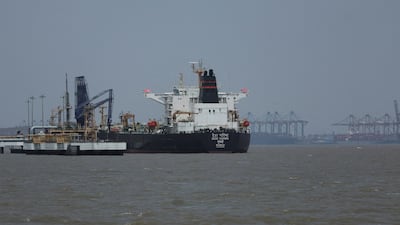A tanker unloads crude oil at a terminal after transiting the Strait of Hormuz. Reuters