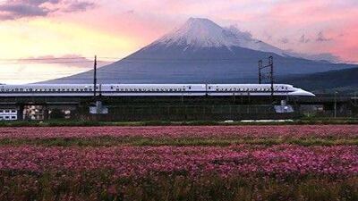 Central Japan Railway's 700 series Shinkansen bullet train travels past Mount Fuji in Shizuoka Prefecture. Tomohiro Ohsumi / Bloomberg News
