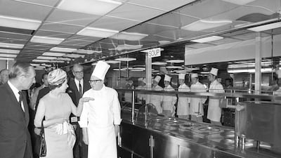 Queen Elizabeth II questions one of the experts as she tours the kitchens during her visit to the QE2 in Southampton, on the eve of the liner's maiden transatlantic voyage to New York, January 1969. Getty Images