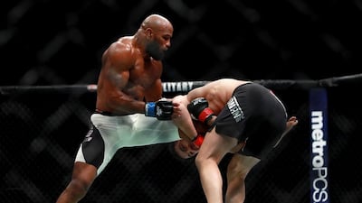 Yoel Romero of Cuba, left, fights against Chris Weidman of the United States in their middleweight bout during the UFC 205 event at Madison Square Garden on November 12, 2016 in New York City. Michael Reaves / Getty Images