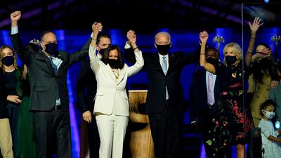 First gentleman Douglas Emhoff, Vice President Kamala Harris, US President Joe Biden and wife Jill Biden salute the crowd after their electoral victory on November 7, 2020. Outgoing president Donald Trump has yet to concede his loss. AFP