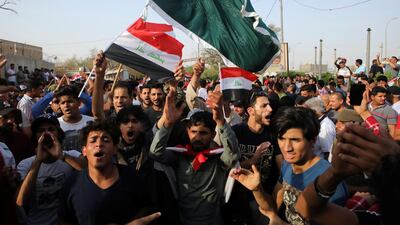 Iraqi protesters at the provincial council building in Basra demand better public services and jobs. AP