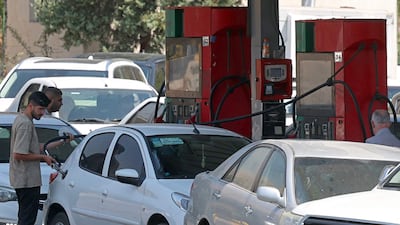 Queues have formed at petrol stations in several cities across Iran as motorists seek to fill up at lower rates. AFP