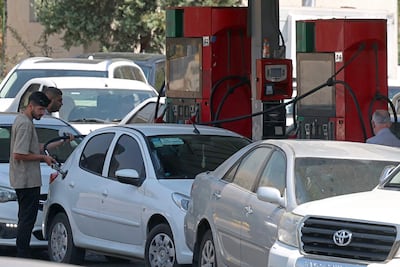 Motorists are facing significant queues as they try to refuel. AFP